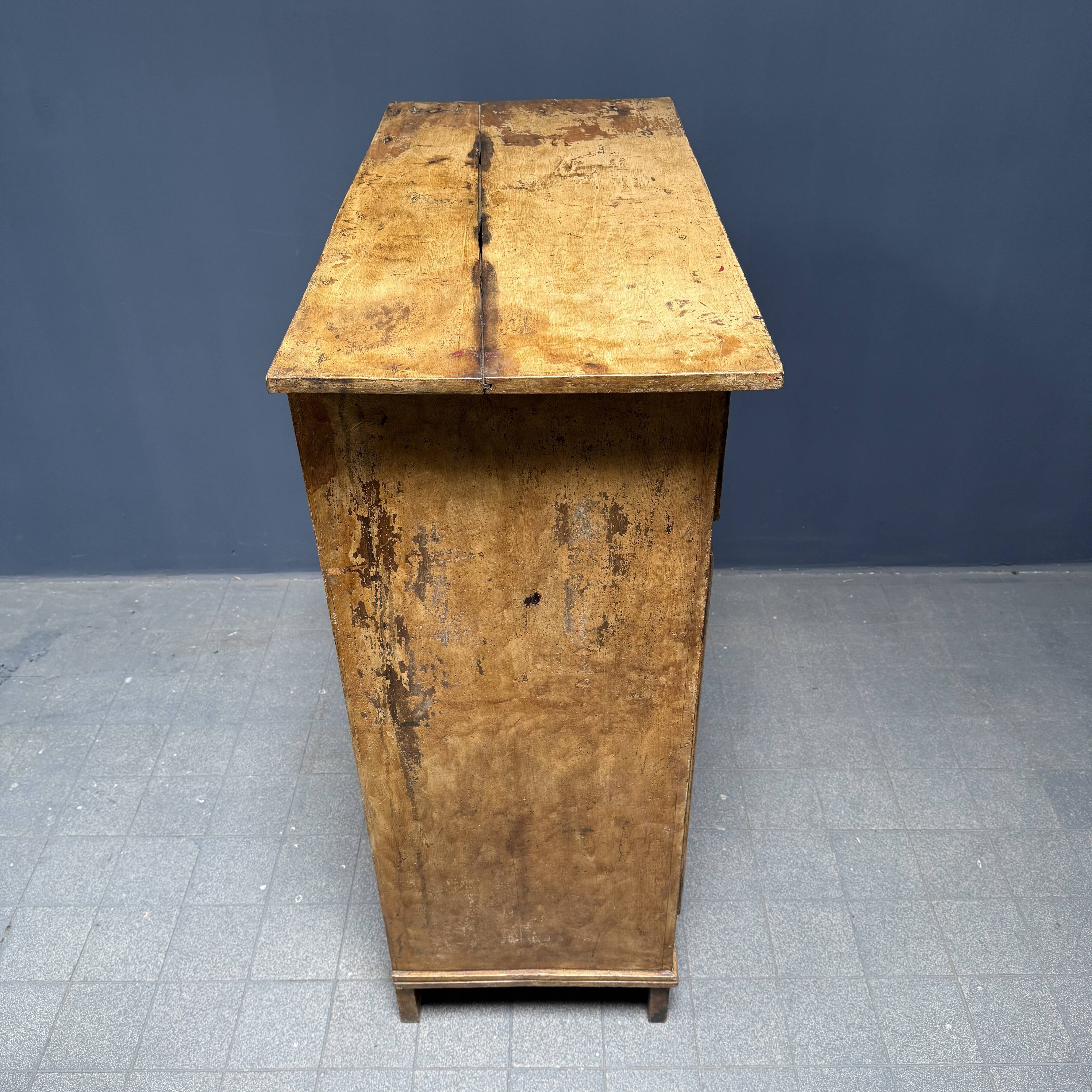 Old marbled ochre yellow French farmhouse cabinet