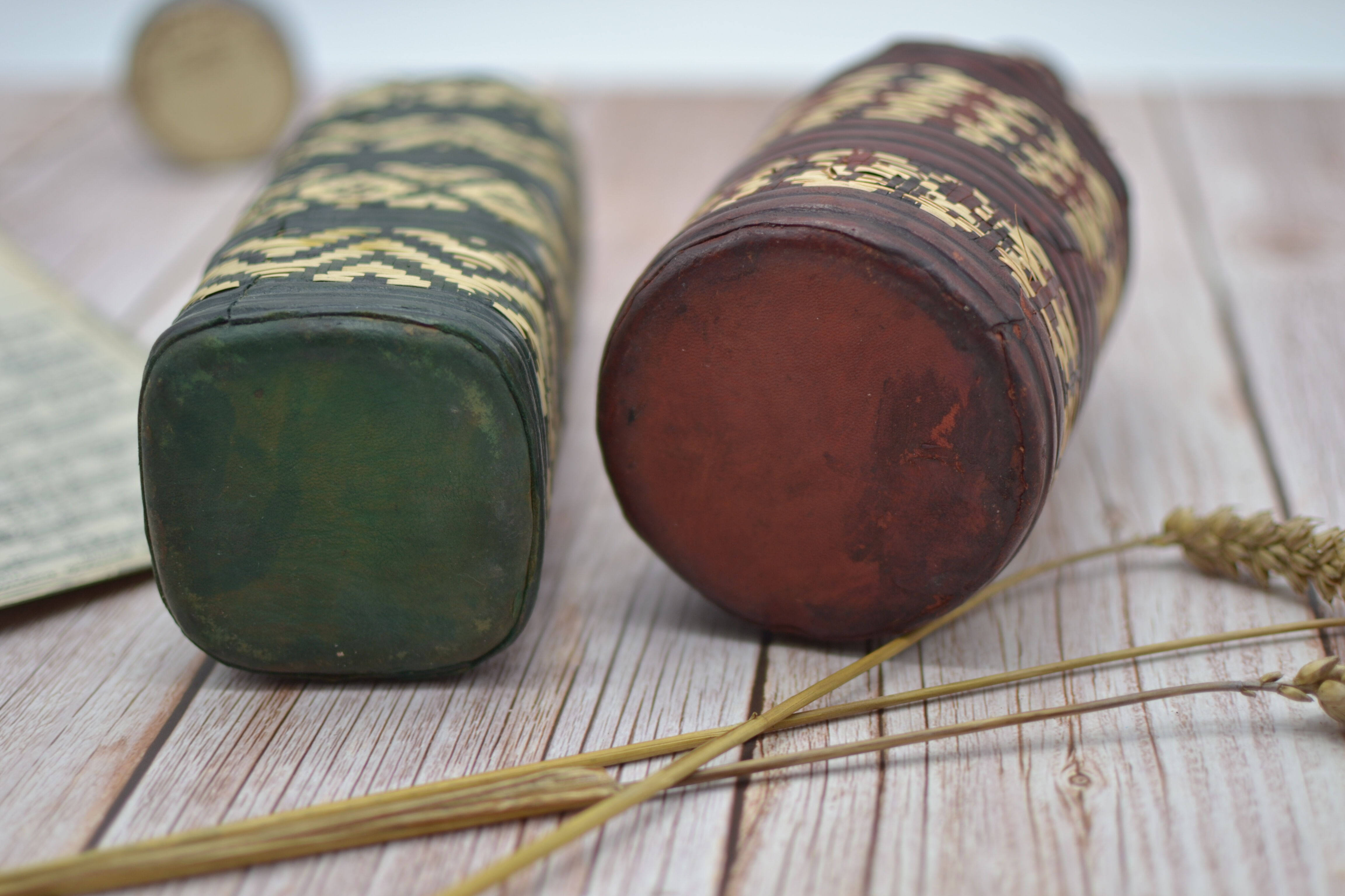 Set of 2 decorative vintage bottles covered with leather & wicker