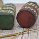Set of 2 decorative vintage bottles covered with leather & wicker