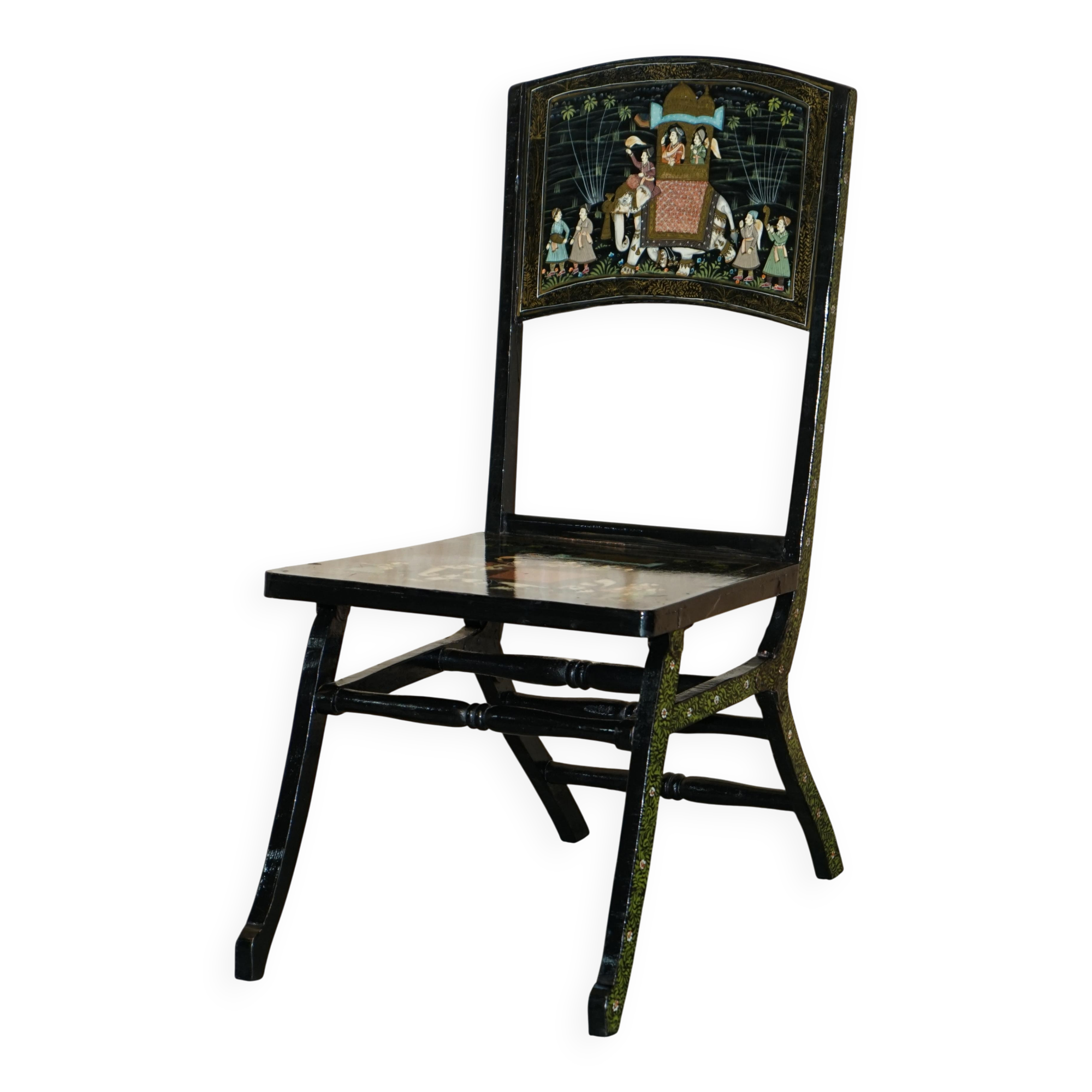 Pair of military folding chairs with Indian decoration.