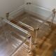 2 side tables in plexiglass, glass, and brass.