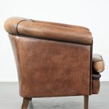 Sturdy vintage sheepskin club armchair with a beautiful patina