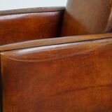 Sheepskin Art Deco design armchair with wood and beautiful cognac-colored leather