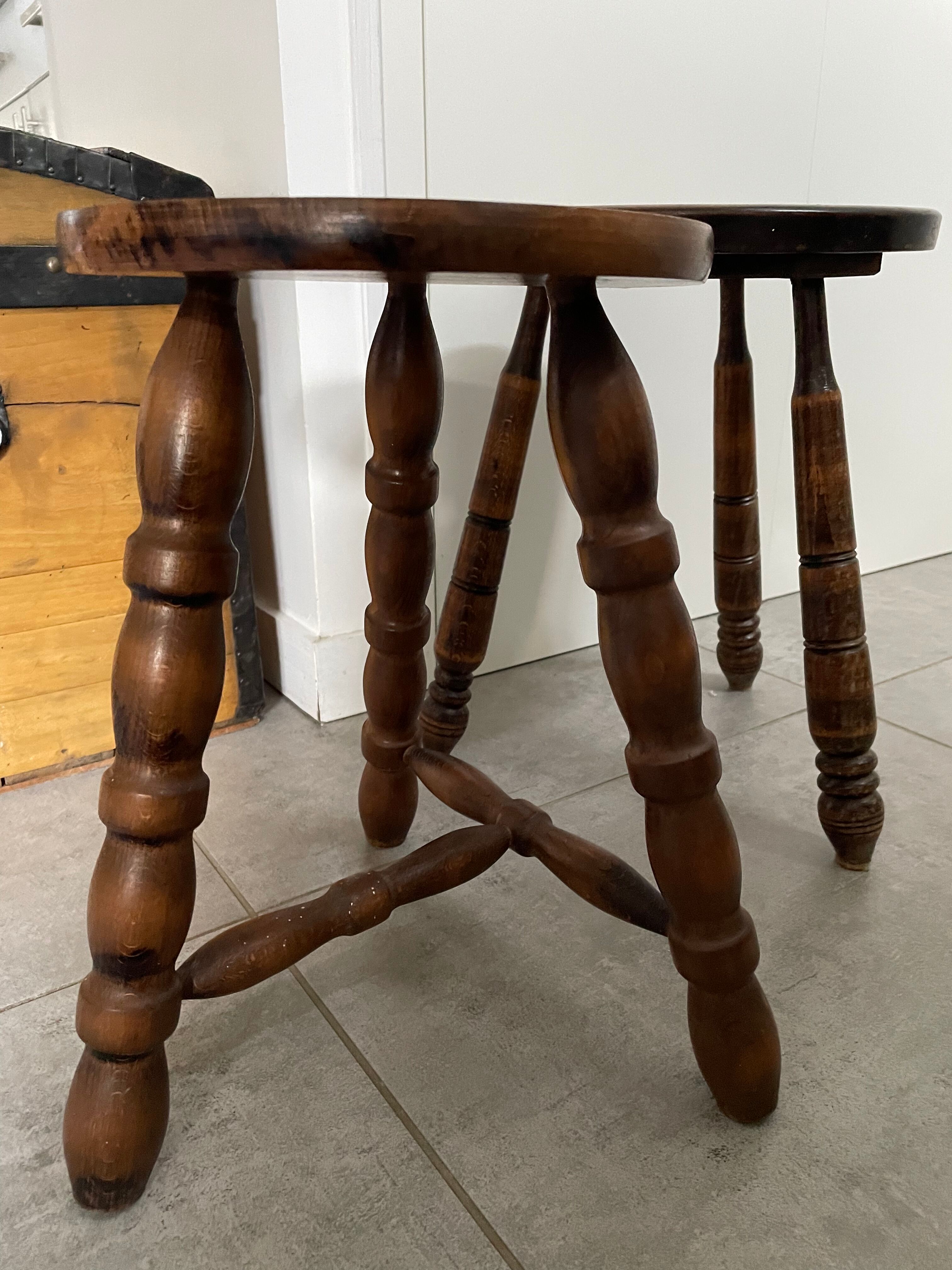 Set of two tripod stools in turned wood