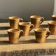 Set of 10 cups and 7 saucers ochre stoneware H7