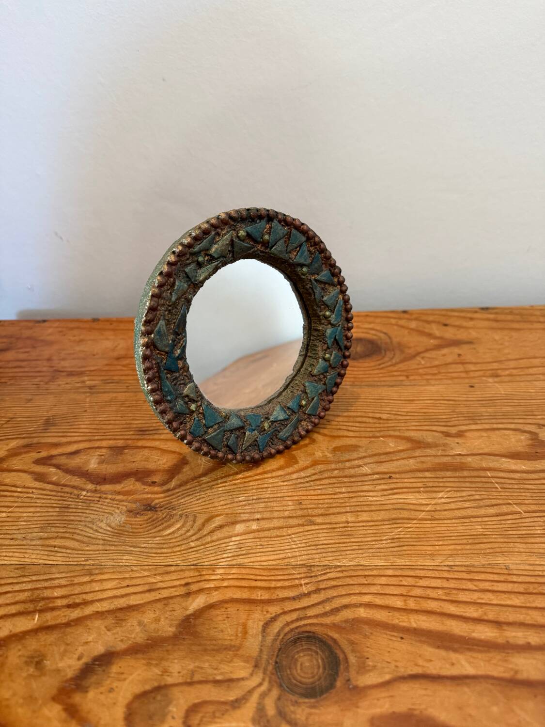 Round mirror in gilded enamelled ceramic with inlay
