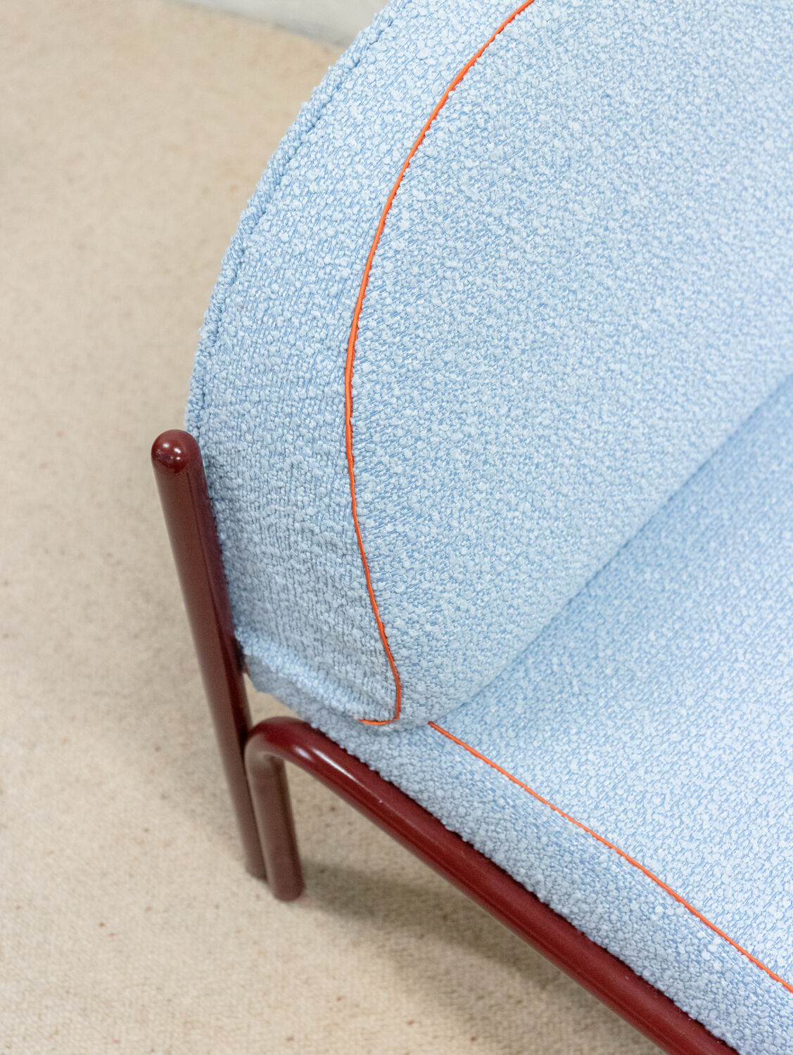 Souvignet armchair reupholstered in sky blue boucle.