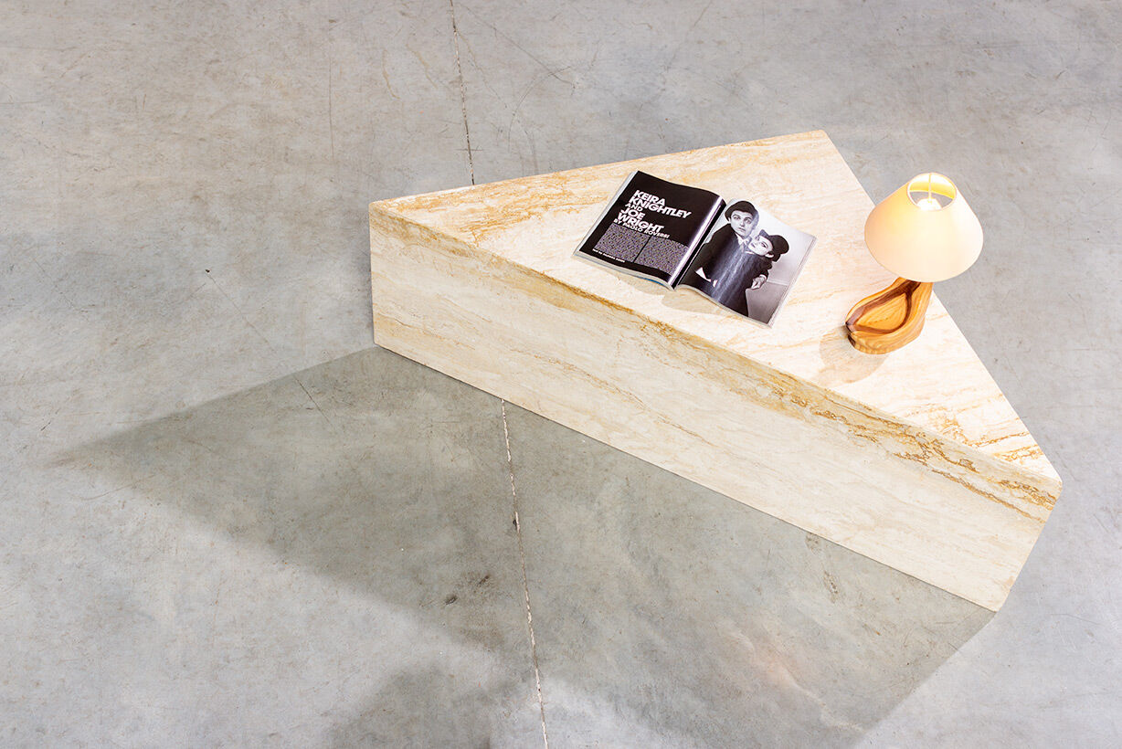Triangular travertine lounge table around 1970 on the modernism