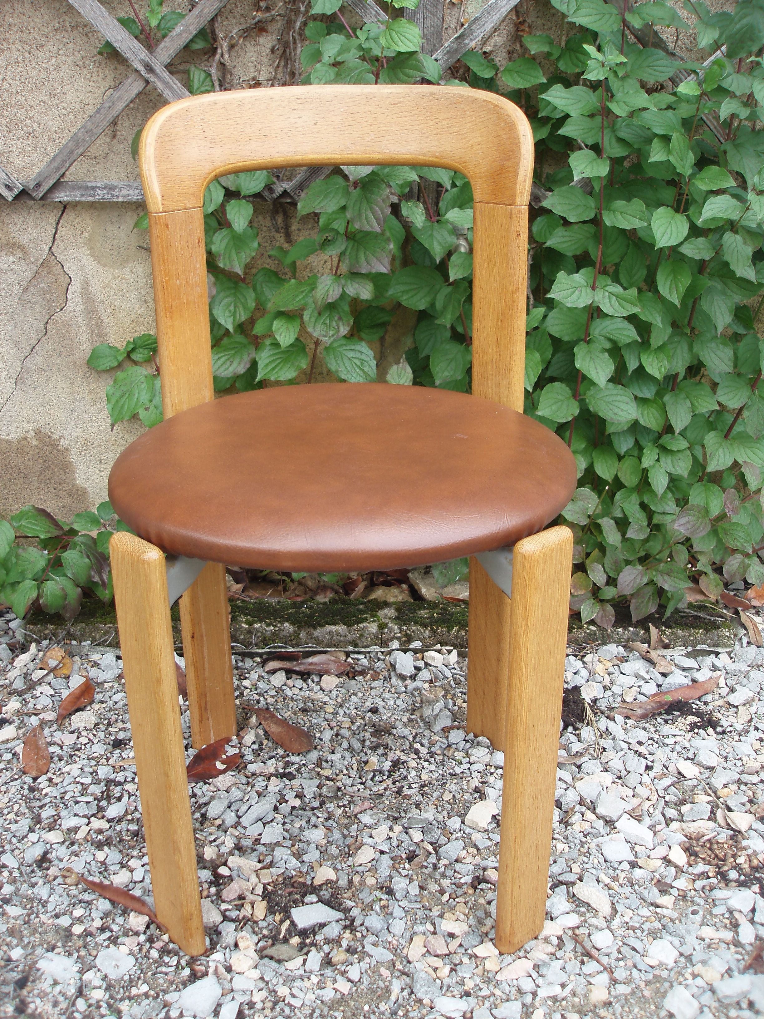 Pair of chairs by Swiss designer Bruno Rey in wood and brown skai