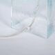 Minimalist glass table lamp from the 80s with a pleated shade.
