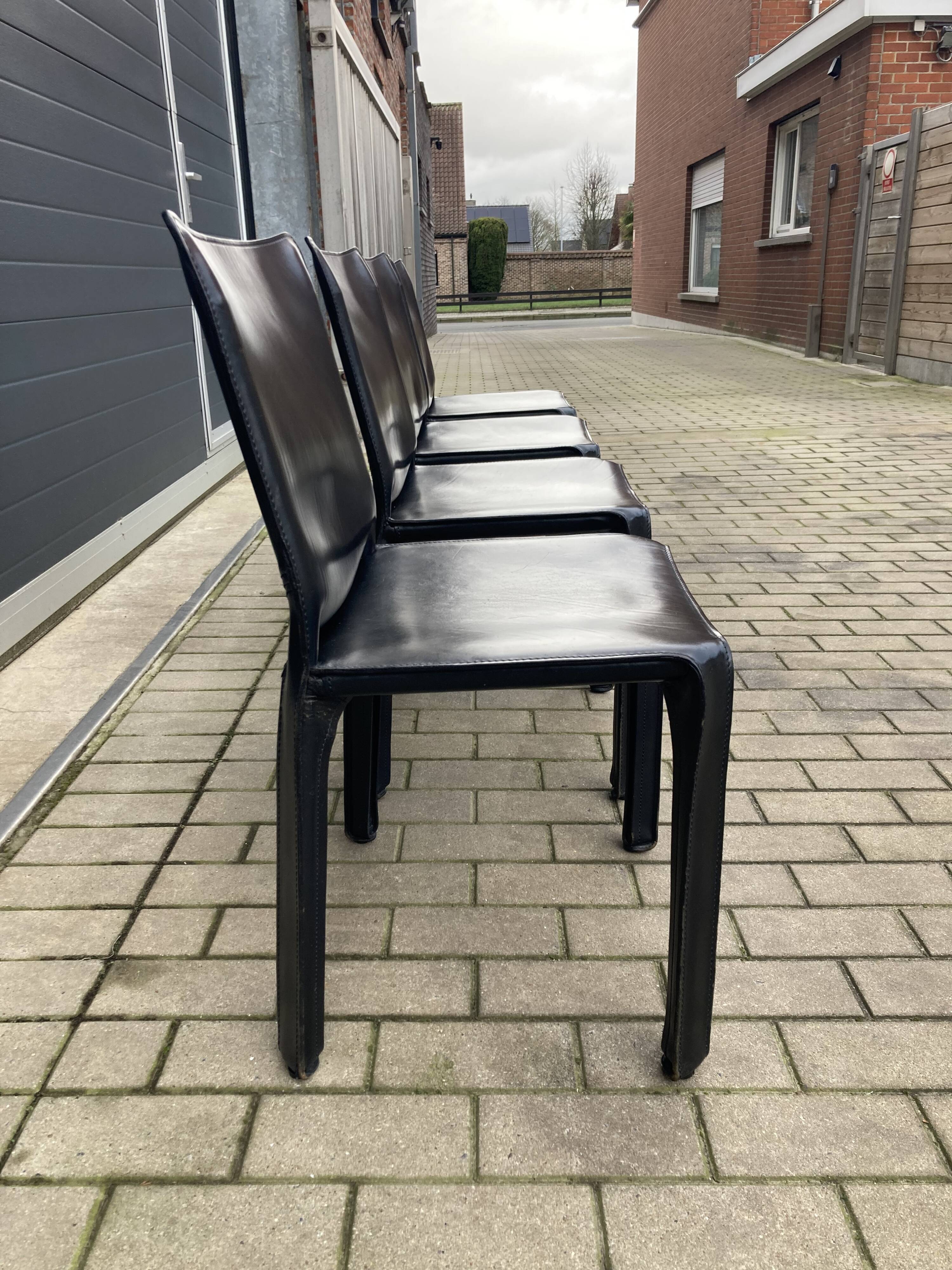 4 black Cassina Cab chairs by Mario Bellini