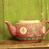Chinese pink mu shou teapot and its cups