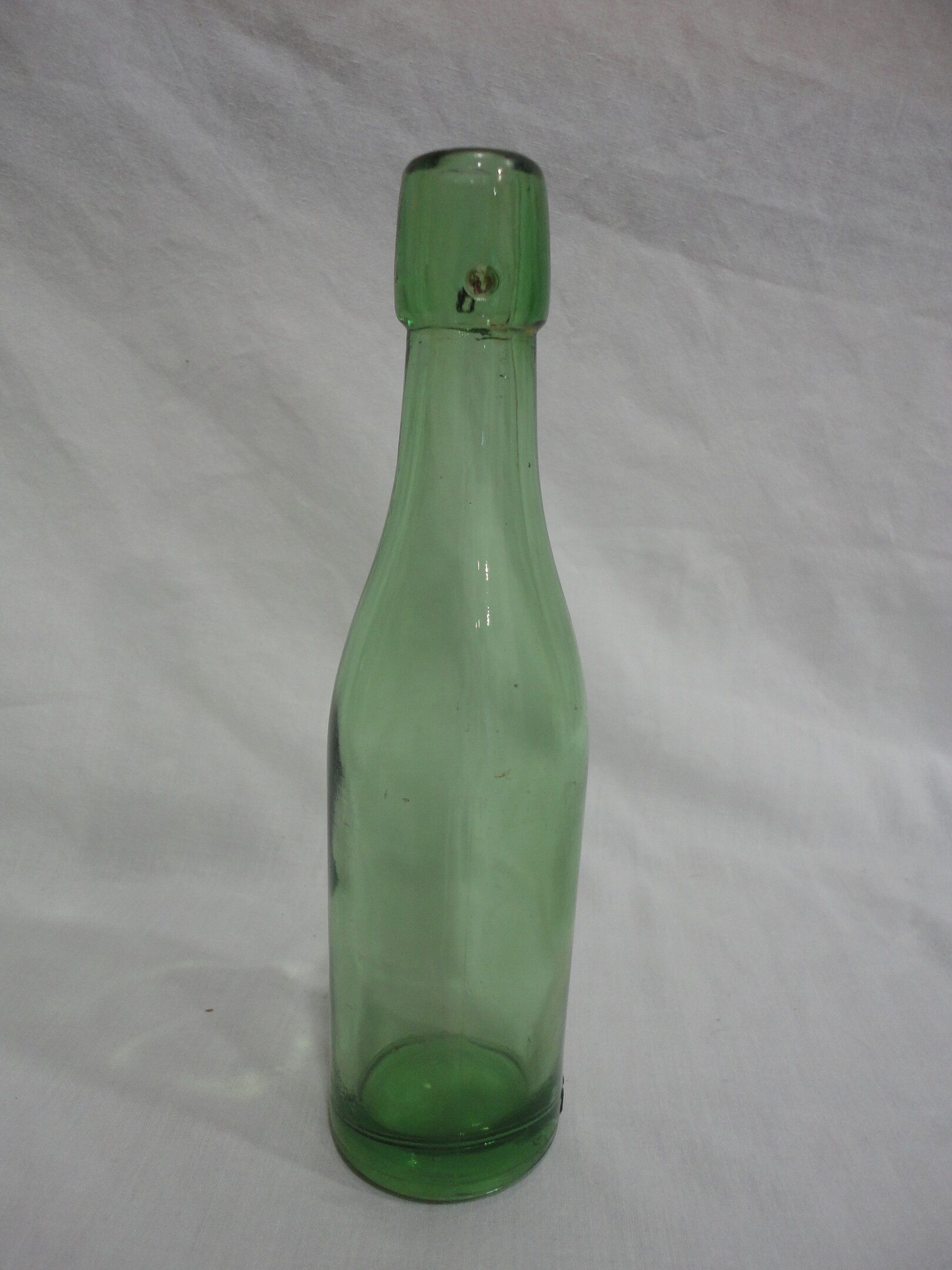 Series of 6 old glass soda bottles