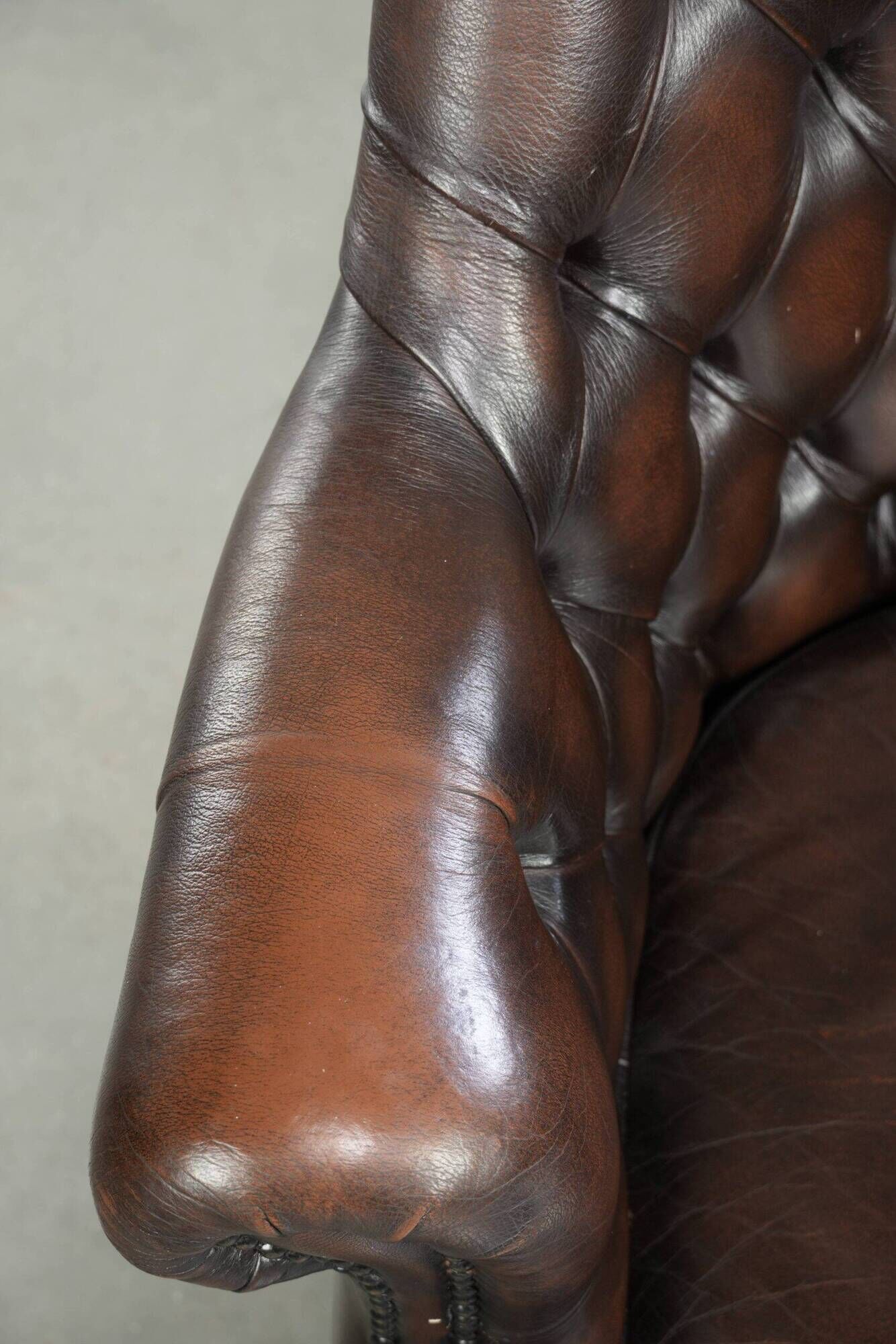 Brown cow leather Chesterfield office chair on wheels in English style