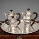 Art Deco tea and coffee service. Silver-plated metal and mahogany.