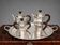 Art Deco tea and coffee service. Silver-plated metal and mahogany.