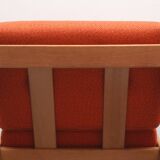 1970s chair in oak and orange cushions