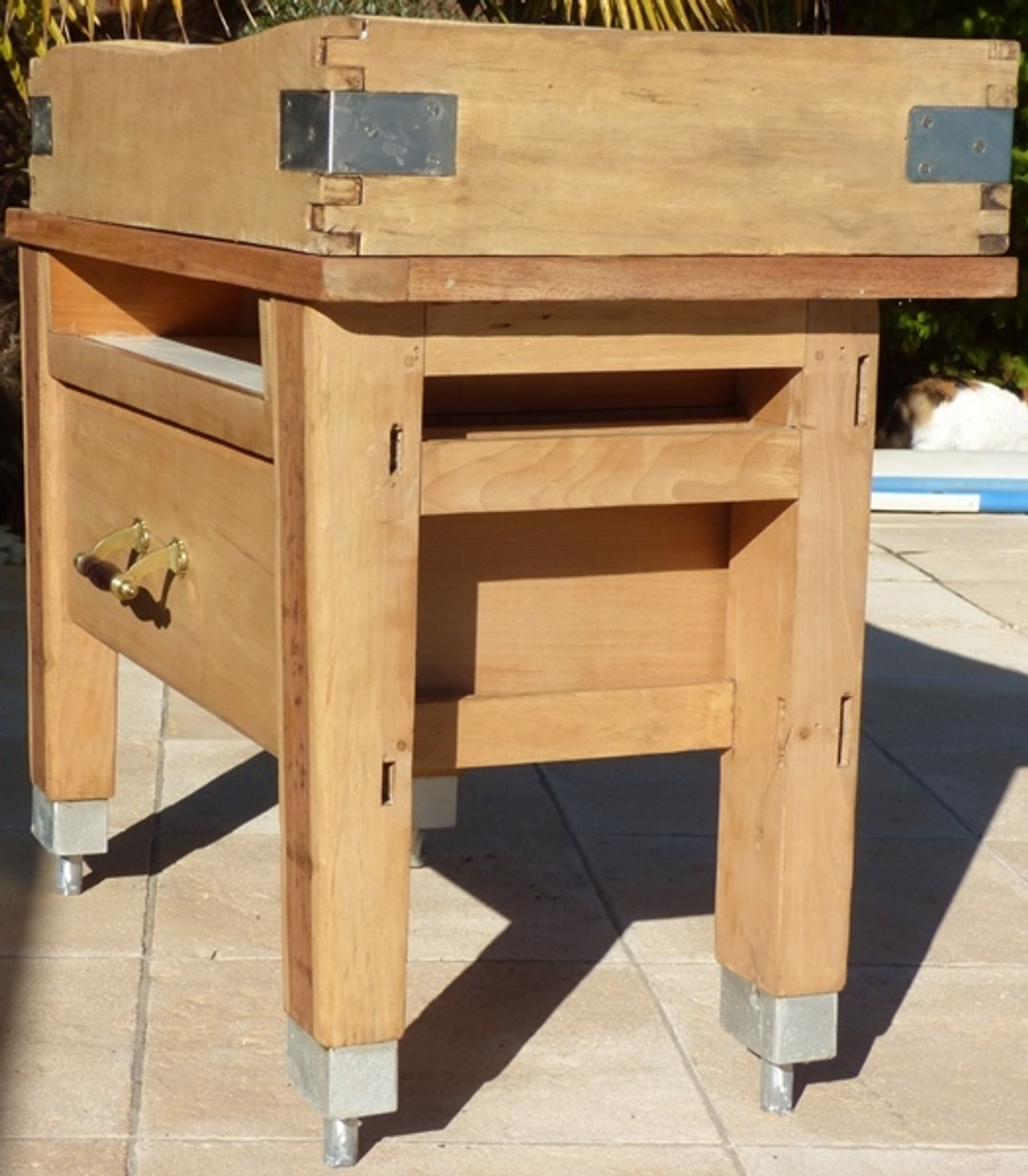 Butcher's log cabinet with two drawers and location for kitchen utensils