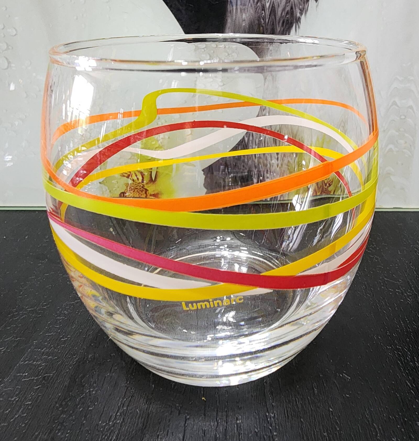 4 vintage Luminarc water glasses with coloured spiral line patterns.