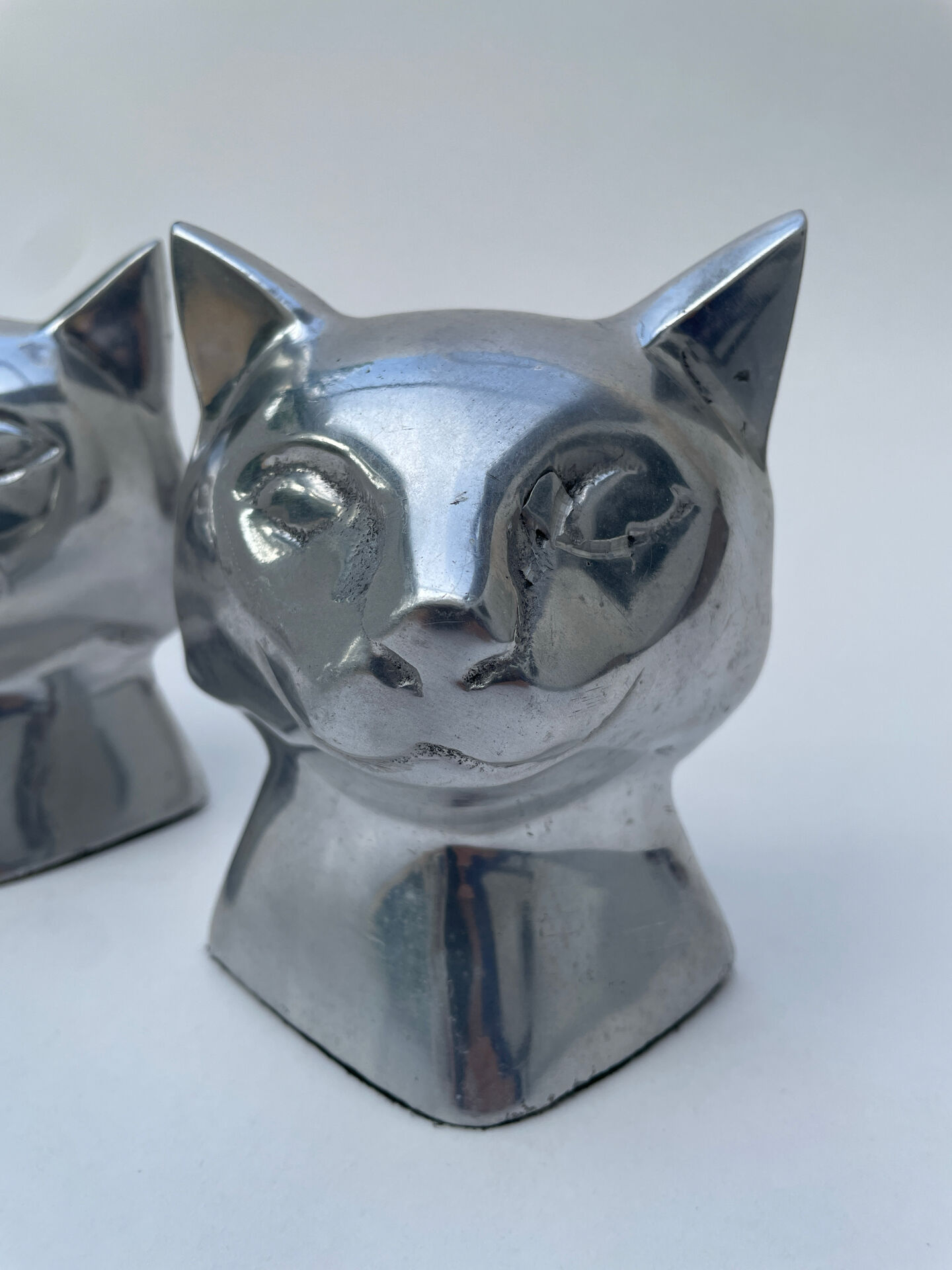 Pair of designer cat head bookends