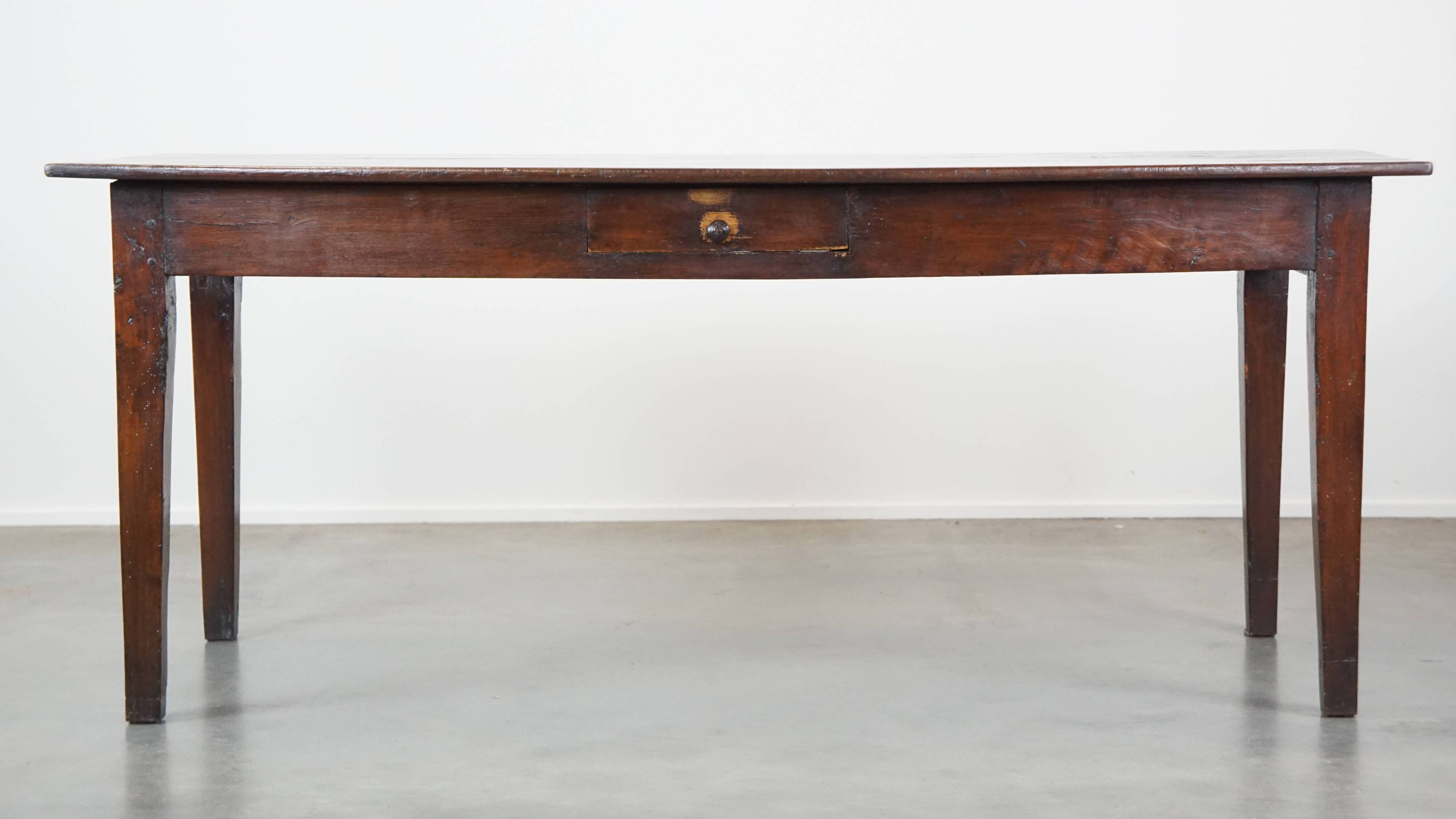 Antique French fruitwood dining table with 2 drawers and patina