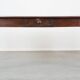 Antique French fruitwood dining table with 2 drawers and patina