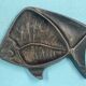 Empty pocket, art deco fish advertising ashtray signed J. André, regulates