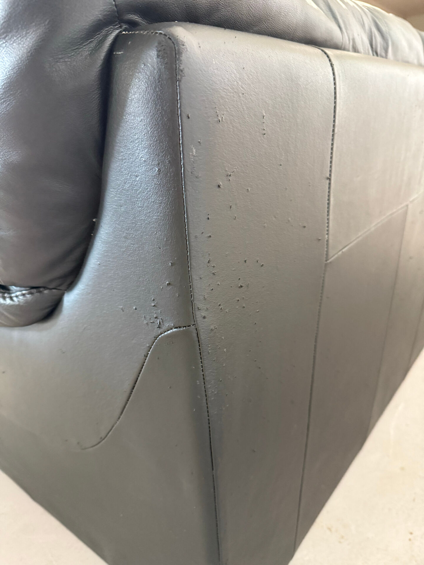 Two-seater black leather sofa — postmodern design