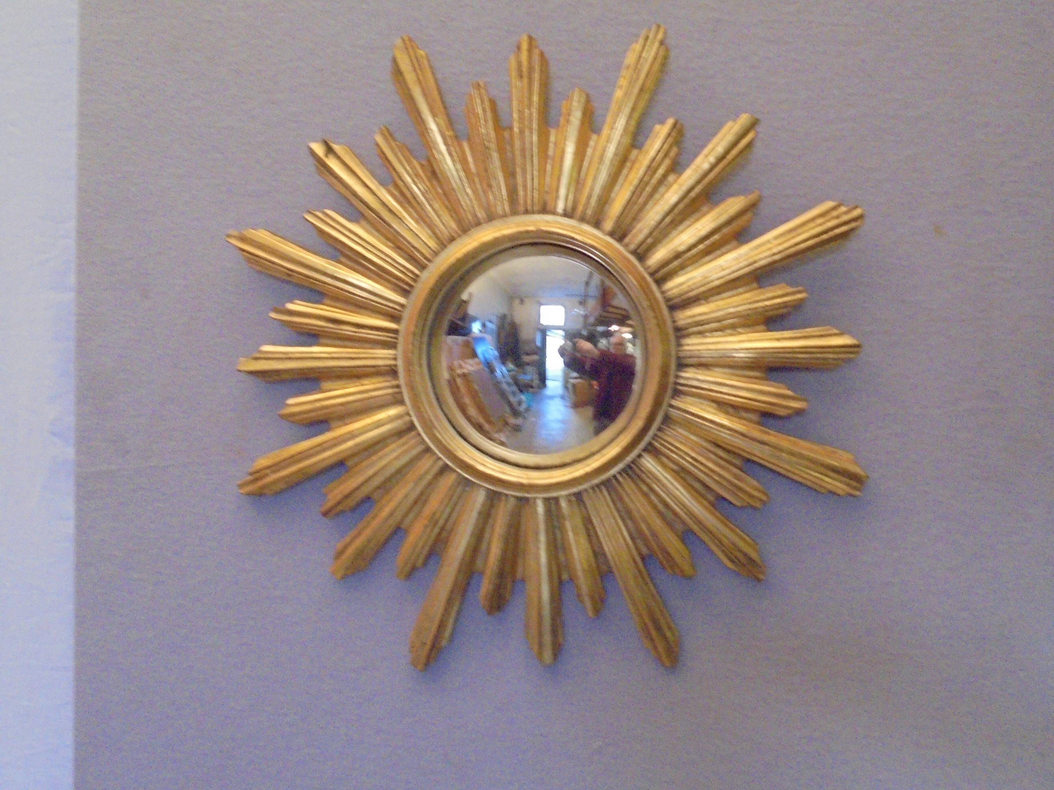 Sun mirror in golden resin from the 70s