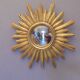 Sun mirror in golden resin from the 70s