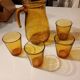 Italian pitcher service and 6 amber glasses
