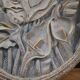 Bas-relief sculpture, stylized face with flowers, 20th century