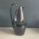 Black glazed ceramic pitcher signed M Azouit