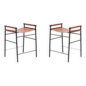 Contemporary bar stool in natural tobacco leather and black metal.