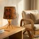 Rattan and bamboo lamp with printed fabric shade.