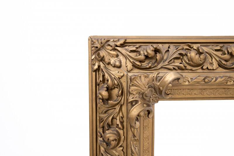 Antique mirror in richly decorated frame, France.