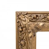Antique mirror in richly decorated frame, France.