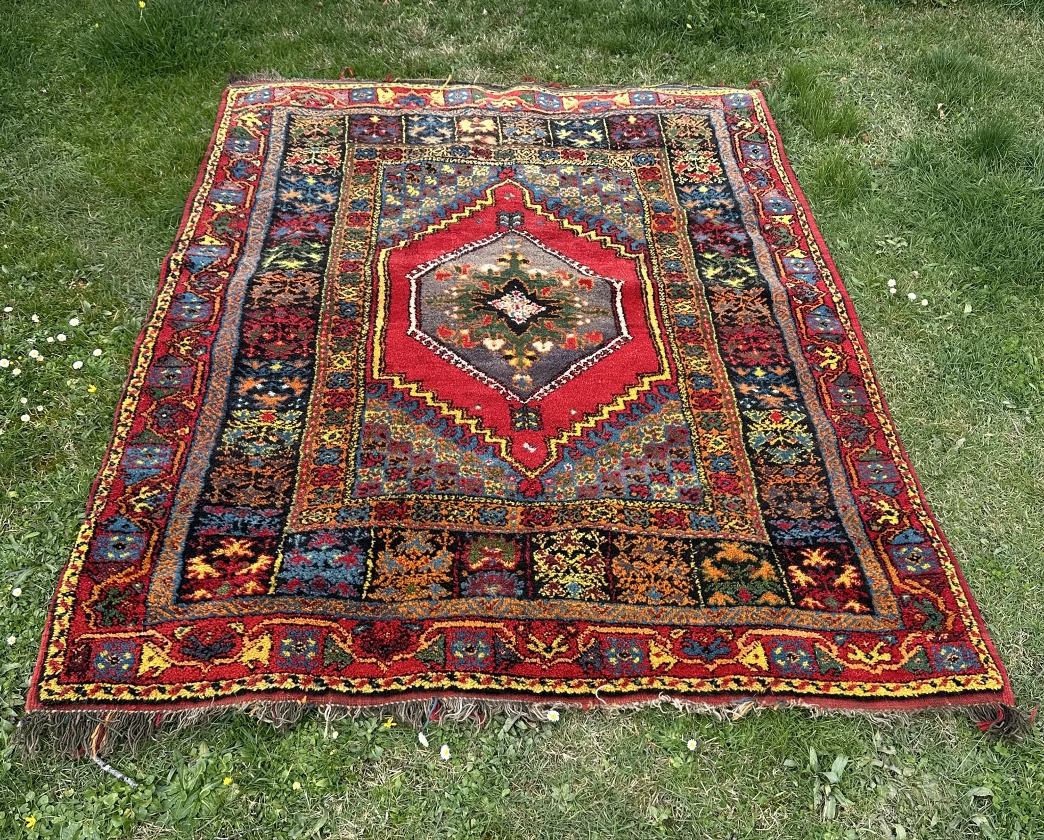 Old Moroccan carpet, made of natural wool and handwoven.