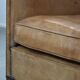 Characterful club chair made of sheepskin leather with light cognac colours