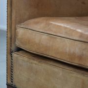 Characterful club chair made of sheepskin leather with light cognac colours