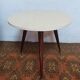 Vintage tripod side table in wood and formica.