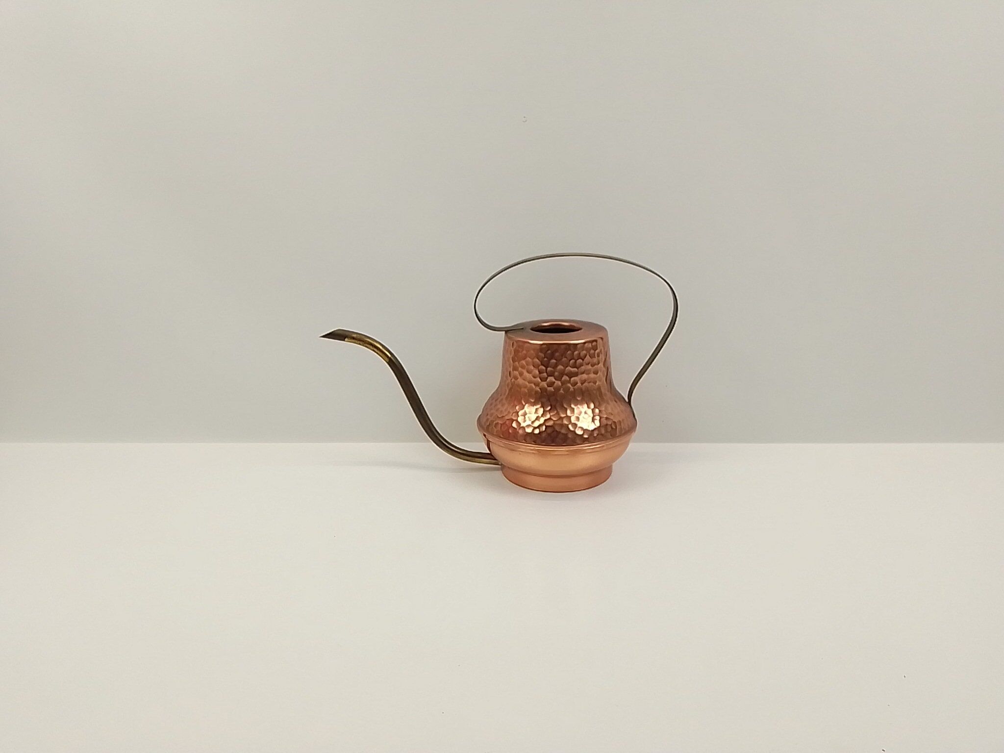 Copper and brass watering can