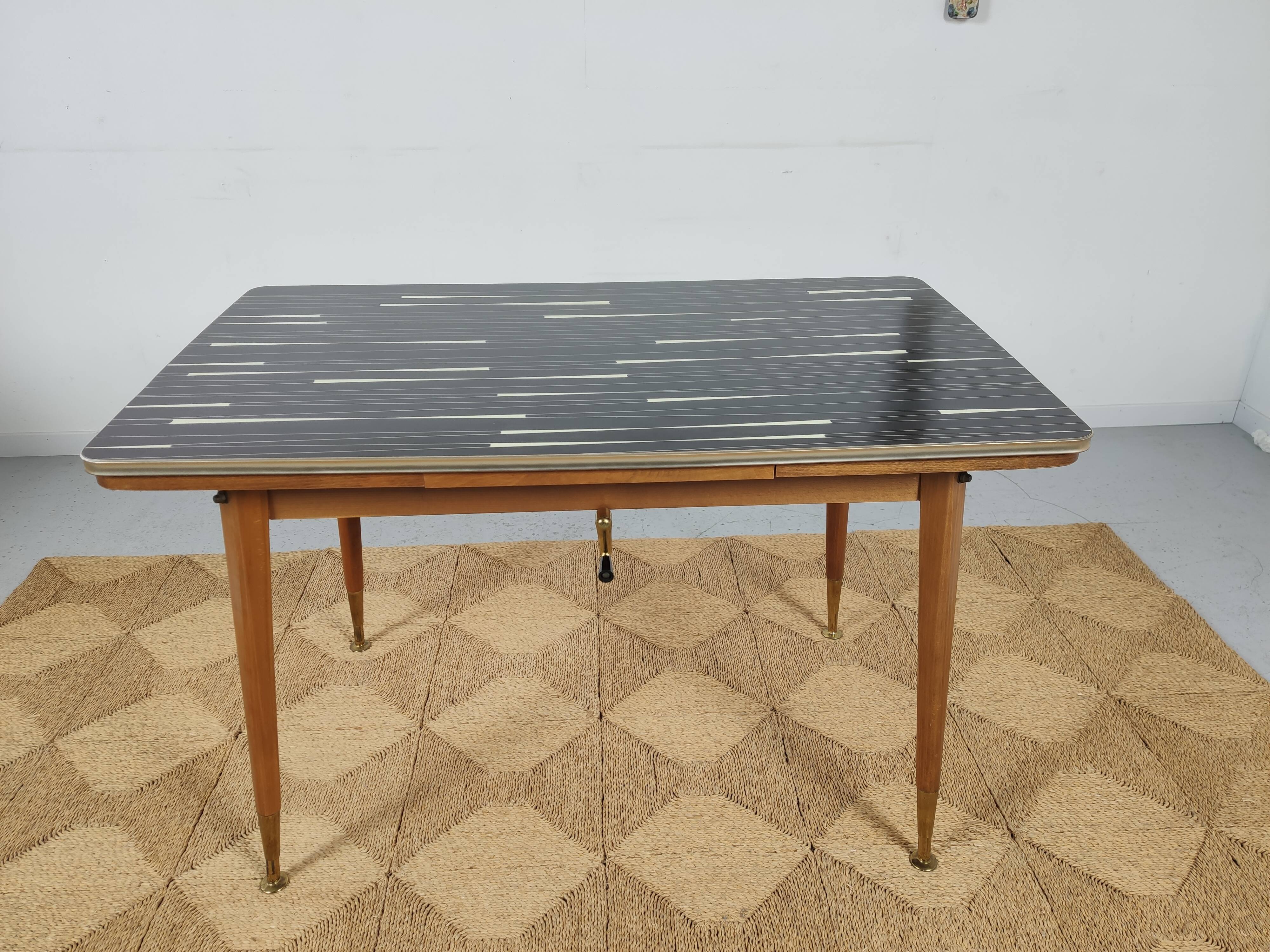 Adjustable vintage table with formica extension cords