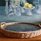 Vintage rattan tray with peacock feather