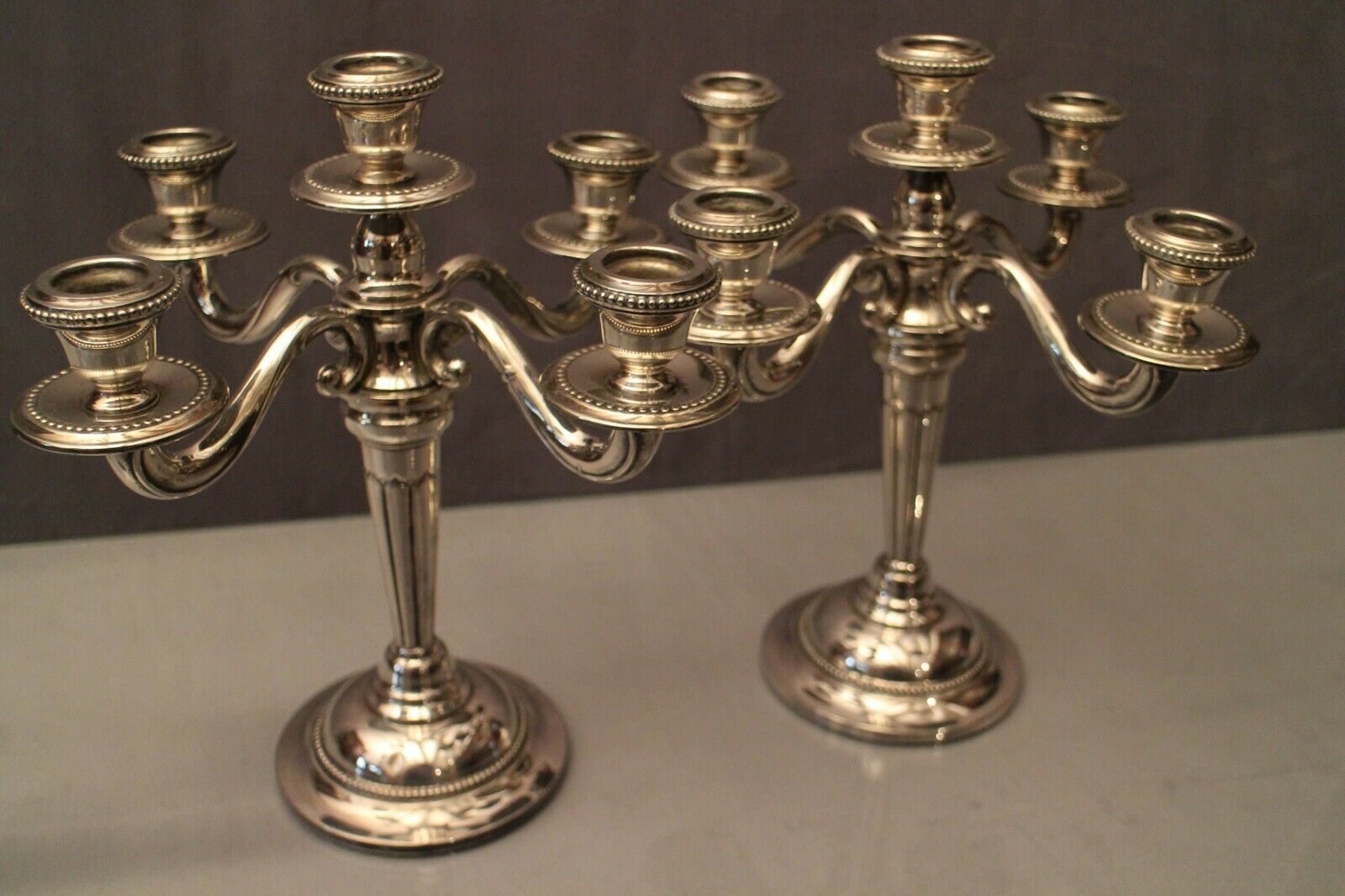 Pair of large candlesticks with 4 silver metal lights in Louis XVI style