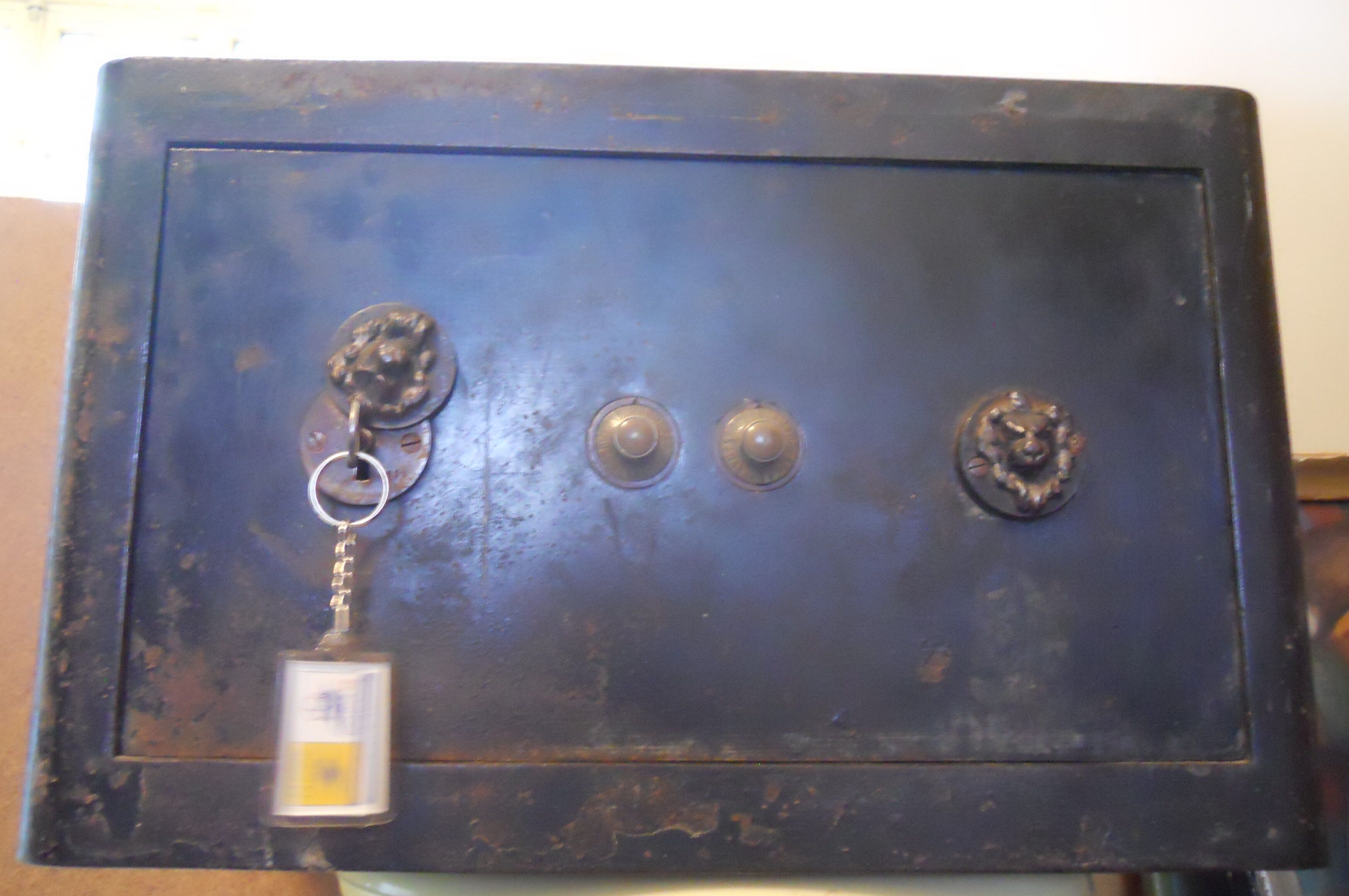 Old safe lion heads