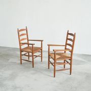 Set of 2 oak and wicker armchairs, mid-20th century.