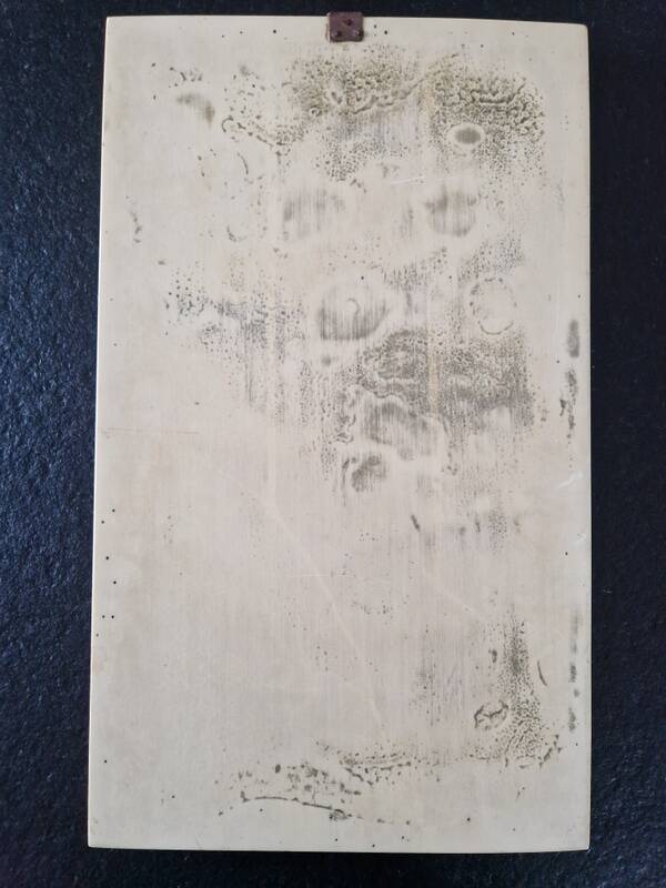 Sculpted resin plaque in the style of China.
