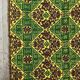Green and yellow handmade rug with delicate colourful flowers