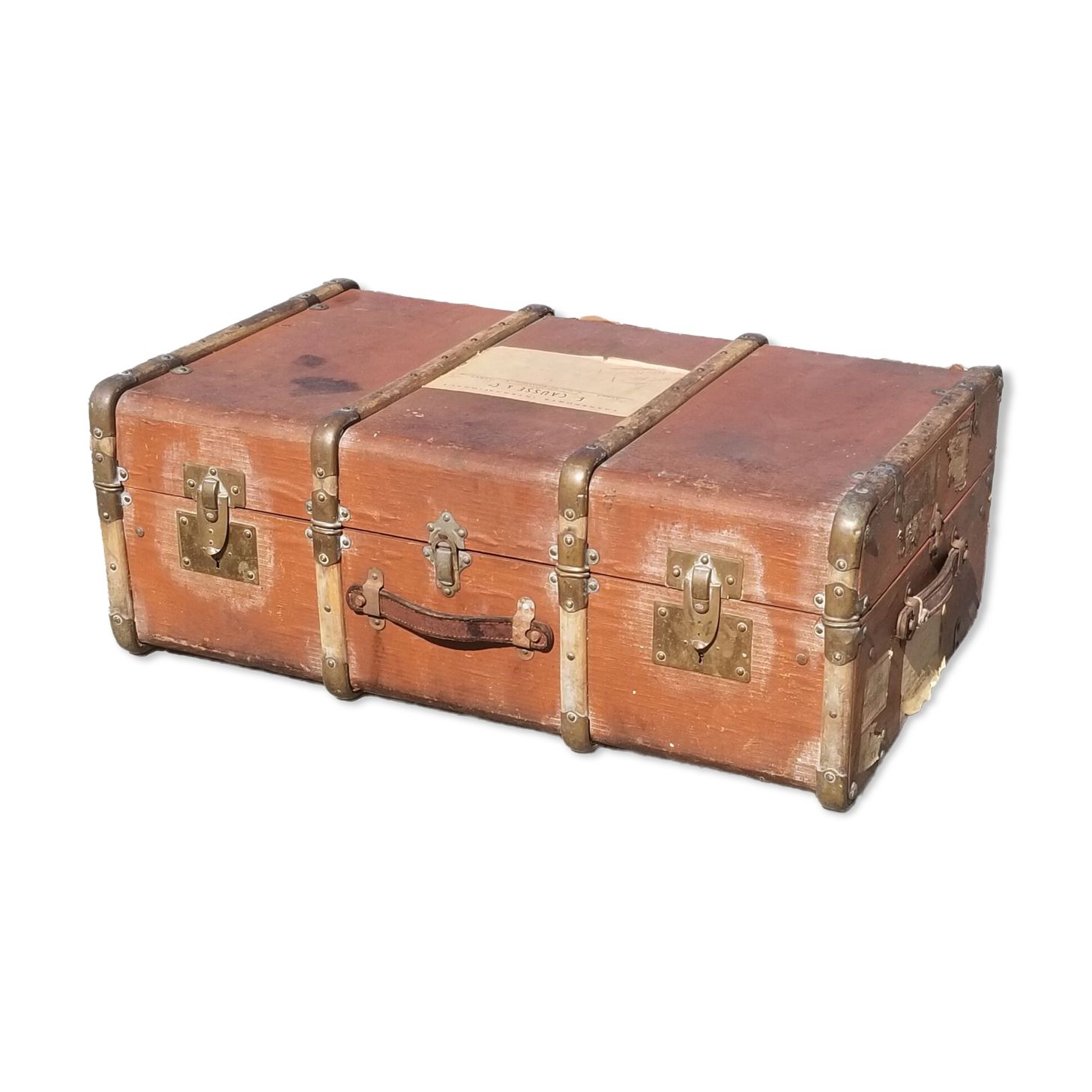Old travel trunk made of wood and brass